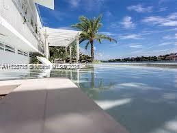 view of swimming pool with a water view