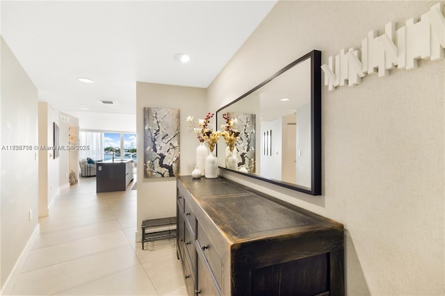 hallway featuring light tile patterned flooring