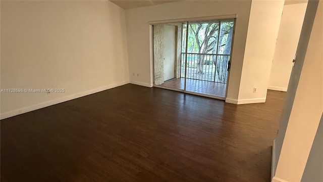 empty room with dark wood-type flooring