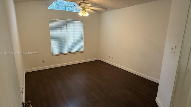 spare room with ceiling fan, dark hardwood / wood-style flooring, and a textured ceiling