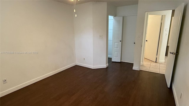 unfurnished room featuring dark hardwood / wood-style flooring