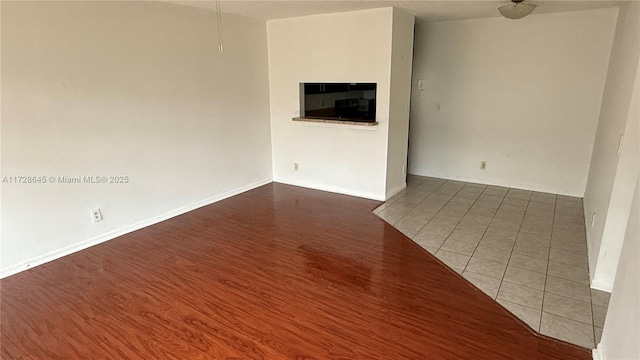 unfurnished living room featuring tile patterned flooring