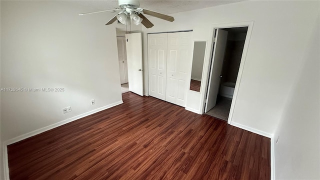 unfurnished bedroom with ceiling fan, dark hardwood / wood-style flooring, and connected bathroom