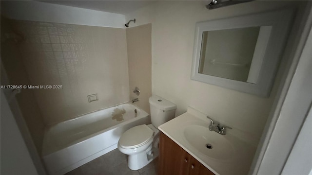 full bathroom featuring toilet, vanity, tile patterned flooring, and shower / tub combination