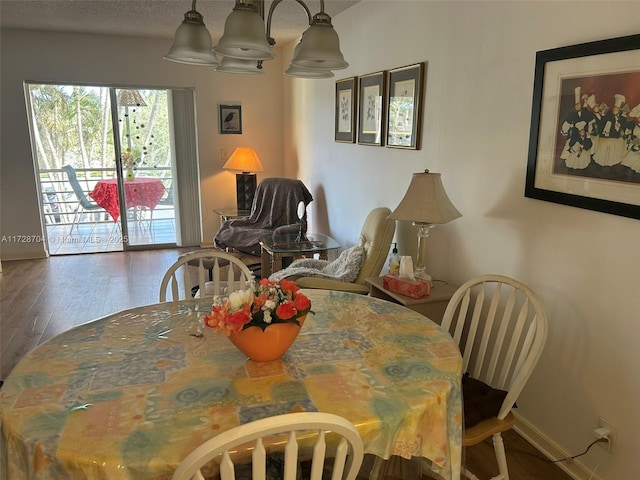 dining area with dark wood-type flooring