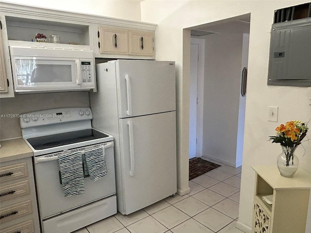 kitchen featuring light tile patterned floors, electric panel, and white appliances