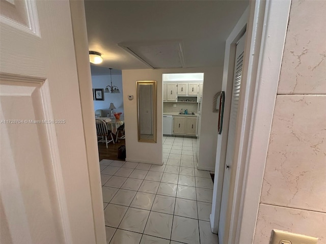 hall with light tile patterned flooring