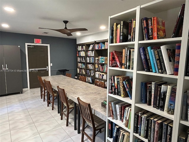 tiled dining room with ceiling fan