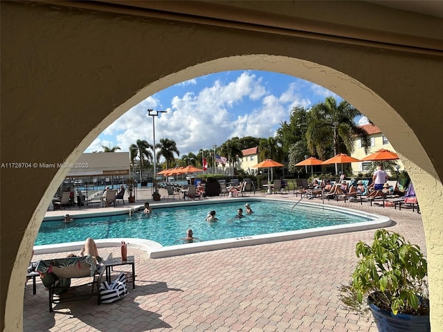 view of swimming pool featuring a patio