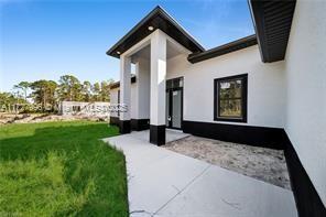 exterior space with a lawn and a patio