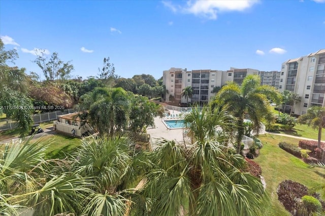 view of home's community featuring a patio area and a pool