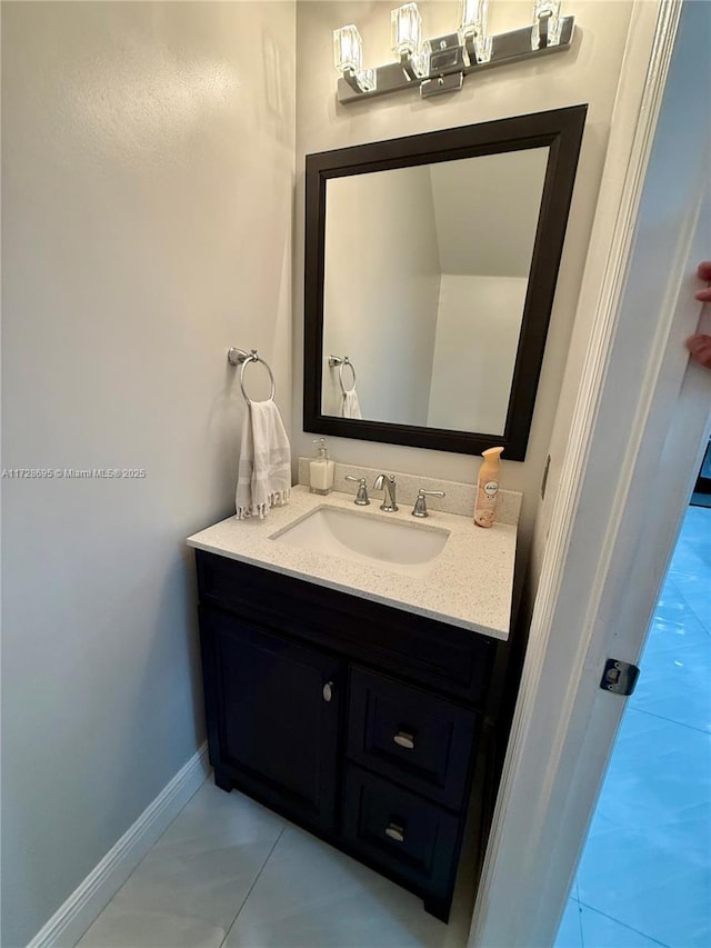 bathroom with tile patterned floors and vanity