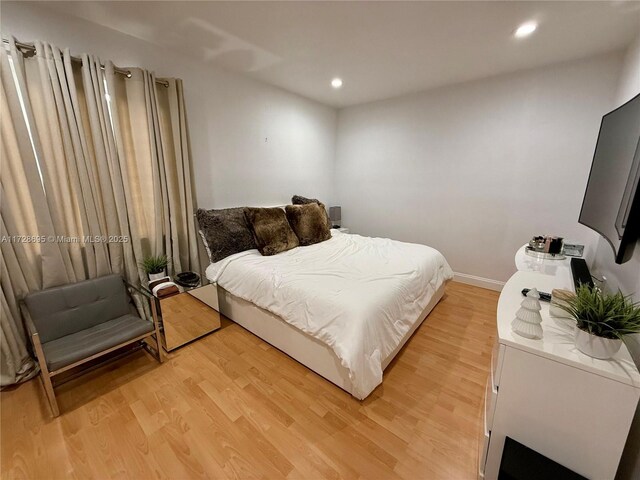 bedroom featuring wood-type flooring