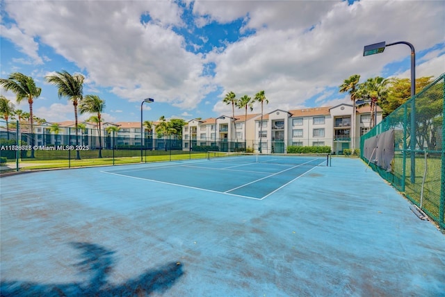 view of sport court with basketball hoop