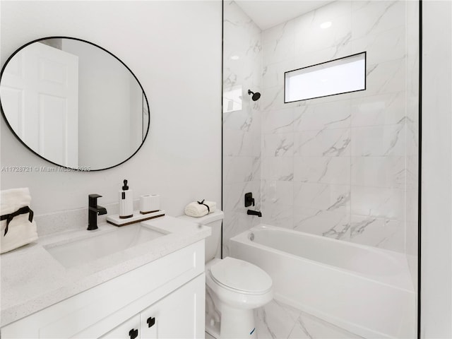 full bathroom featuring toilet, vanity, and tiled shower / bath