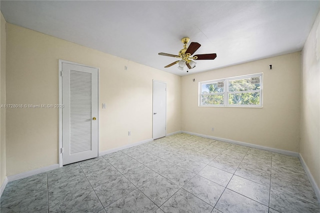 spare room with ceiling fan