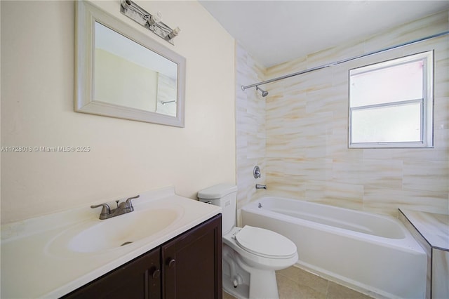 full bathroom featuring tiled shower / bath, vanity, toilet, and tile patterned flooring