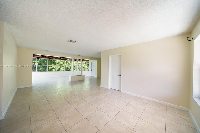 spare room with light tile patterned floors