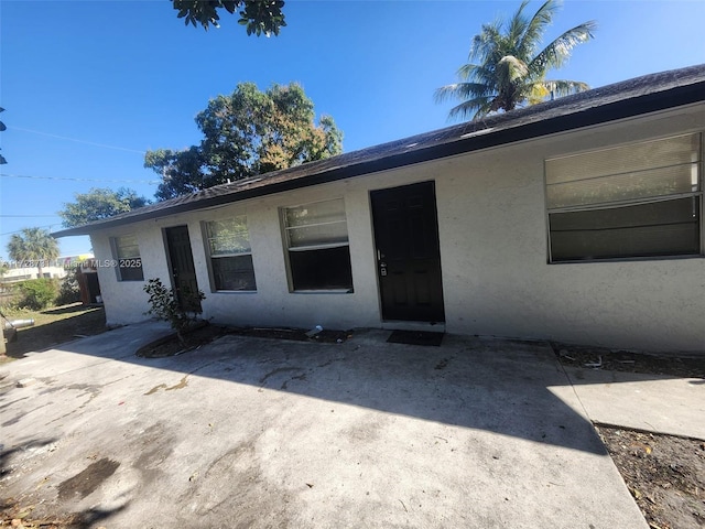 single story home featuring a patio