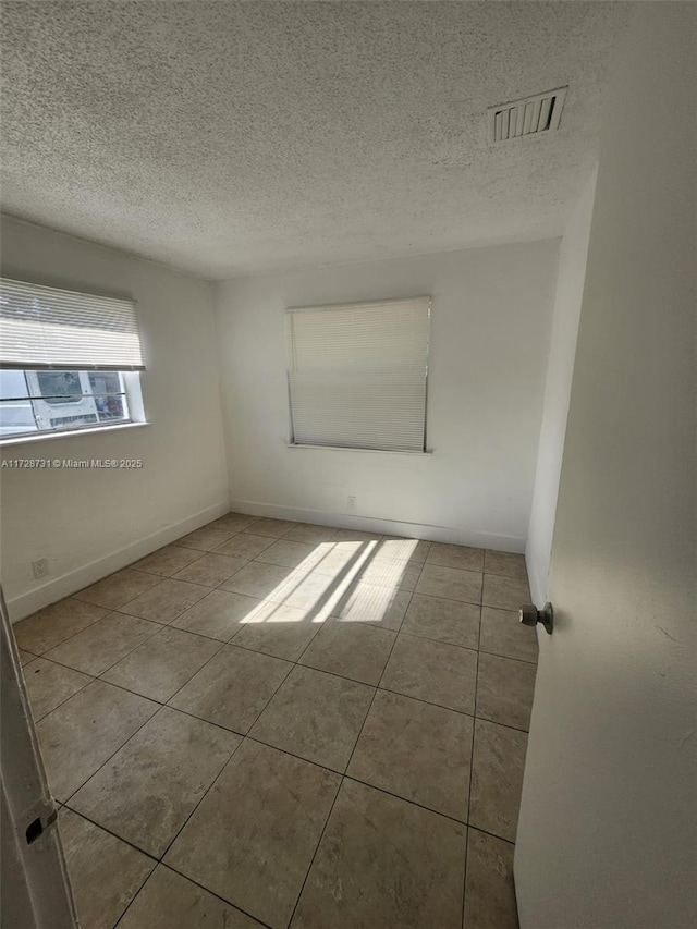 view of tiled spare room