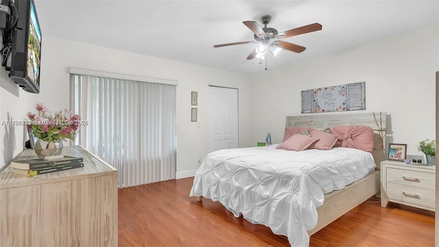 bedroom with ceiling fan and light wood-type flooring