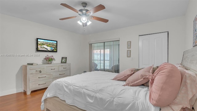 bedroom with ceiling fan and light hardwood / wood-style floors