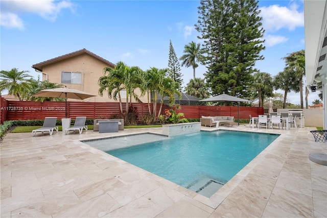 view of pool featuring pool water feature, an outdoor hangout area, and a patio area