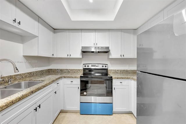 2009 SE 10th Ave Unit 302, Fort Lauderdale, FL 33316 - kitchen with appliances with stainless steel finishes, under cabinet range hood, a sink, and white cabinets