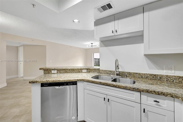 2009 SE 10th Ave Unit 302, Fort Lauderdale, FL 33316 - kitchen with stainless steel dishwasher, a sink, white cabinets, light stone countertops, and recessed lighting