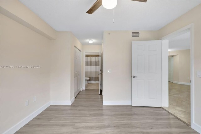 2009 SE 10th Ave Unit 302, Fort Lauderdale, FL 33316 - unfurnished bedroom featuring light wood finished floors, baseboards, and a ceiling fan