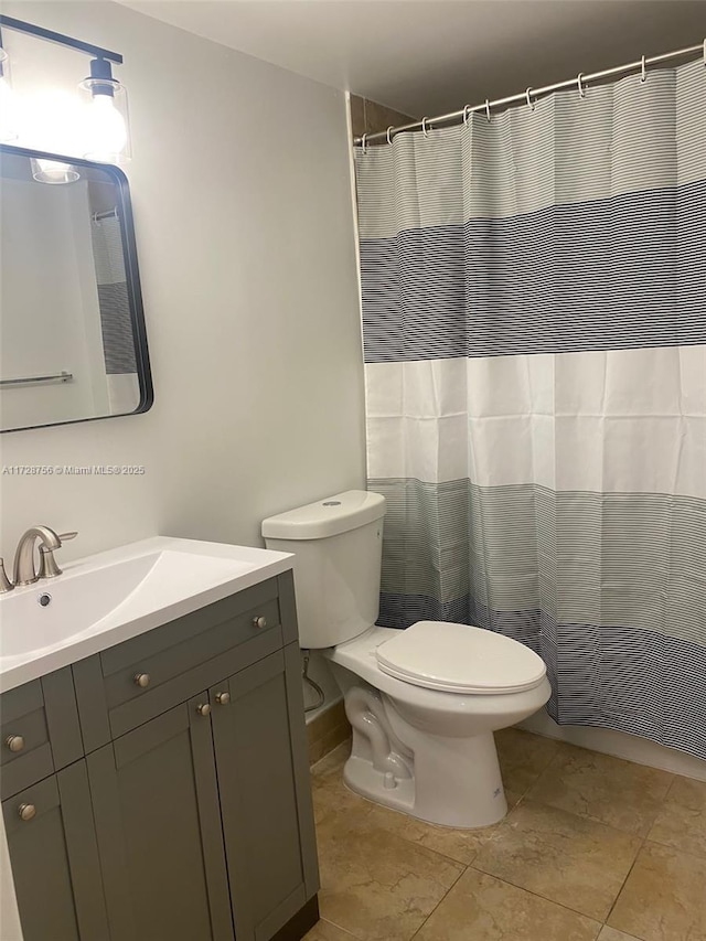 bathroom with toilet and vanity