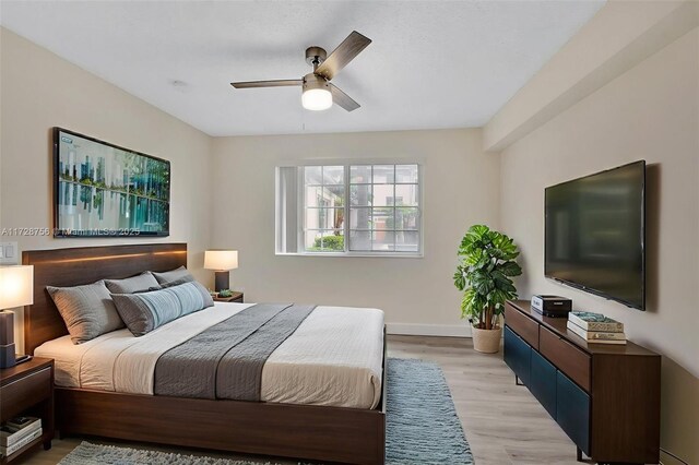 2009 SE 10th Ave Unit 302, Fort Lauderdale, FL 33316 - bedroom featuring light wood-type flooring, baseboards, and ceiling fan