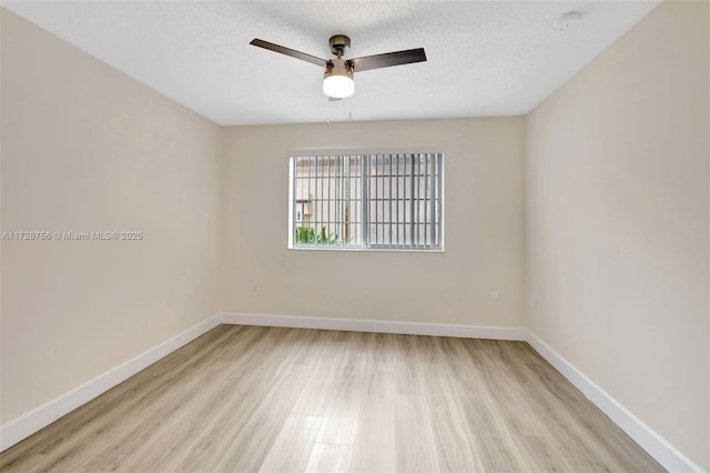 2009 SE 10th Ave Unit 302, Fort Lauderdale, FL 33316 - unfurnished room with light wood-style flooring, ceiling fan, baseboards, a textured ceiling, and a smoke detector