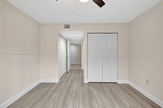 2009 SE 10th Ave Unit 302, Fort Lauderdale, FL 33316 - unfurnished bedroom with baseboards, light wood finished floors, a closet, recessed lighting, and a ceiling fan