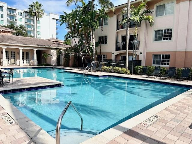 view of swimming pool featuring a patio area