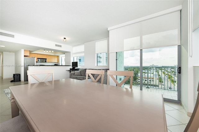 dining space with light tile patterned flooring