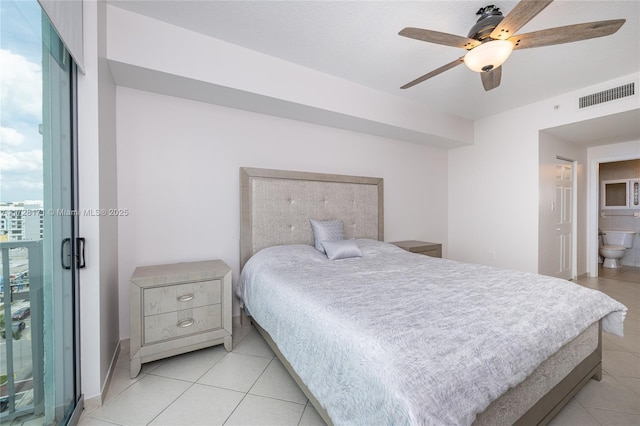 tiled bedroom featuring ceiling fan, ensuite bathroom, and access to exterior