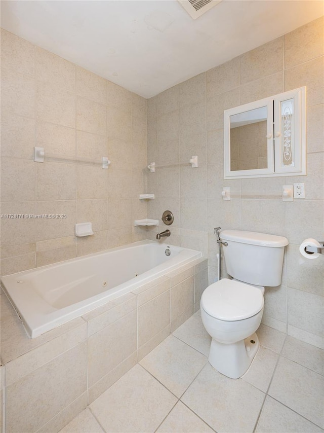 bathroom featuring toilet, tile walls, and tile patterned floors