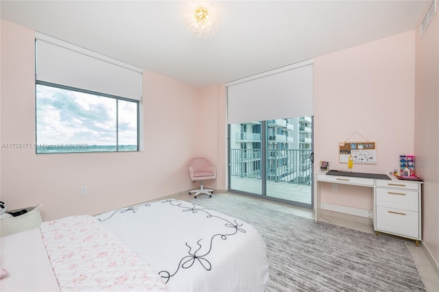 tiled bedroom with access to exterior