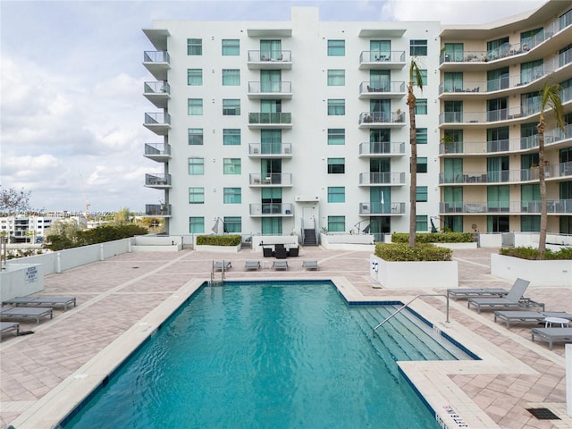 view of pool featuring a patio area