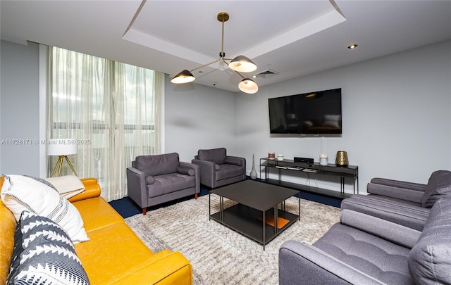 living room with a tray ceiling