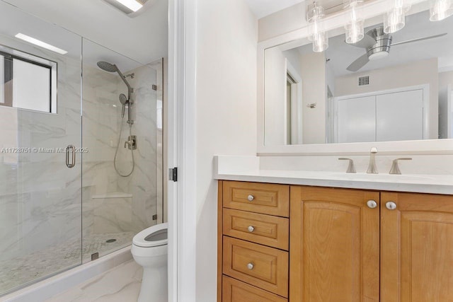 bathroom with vanity, toilet, and an enclosed shower