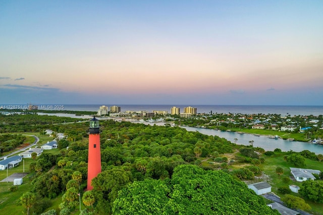 aerial view at dusk with a water view