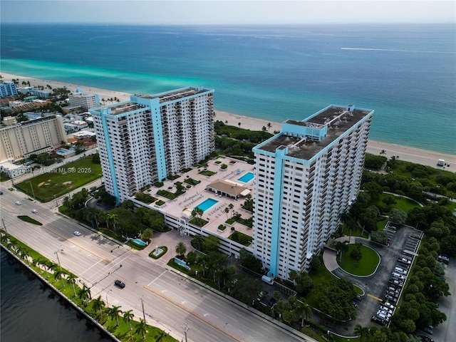 bird's eye view with a water view and a view of the beach