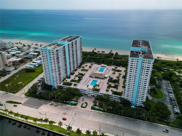 bird's eye view featuring a water view and a view of the beach