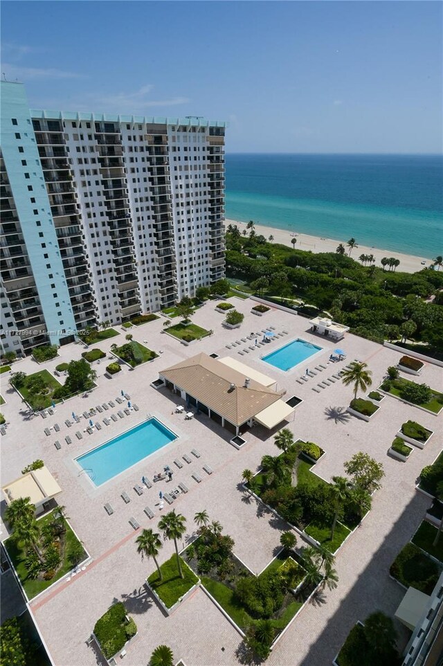 aerial view featuring a water view and a view of the beach