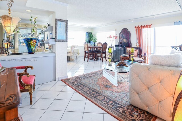 tiled living room featuring a textured ceiling