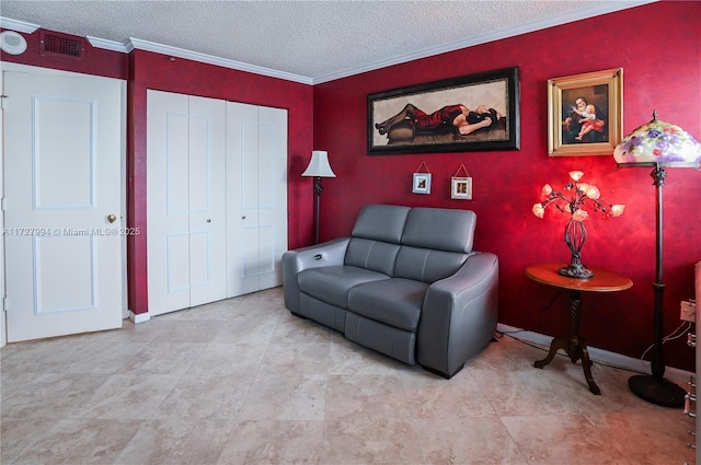 sitting room with crown molding and a textured ceiling