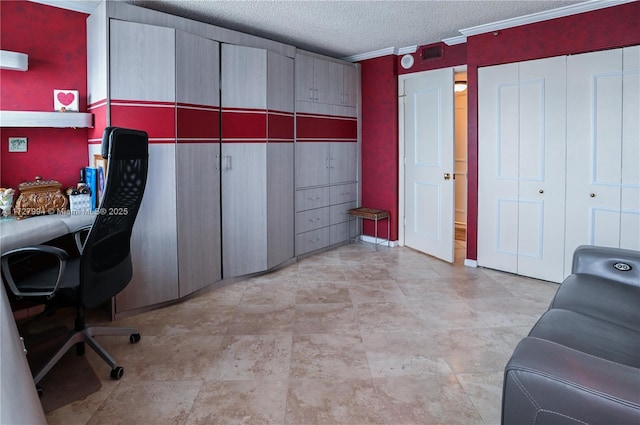 home office featuring ornamental molding and a textured ceiling