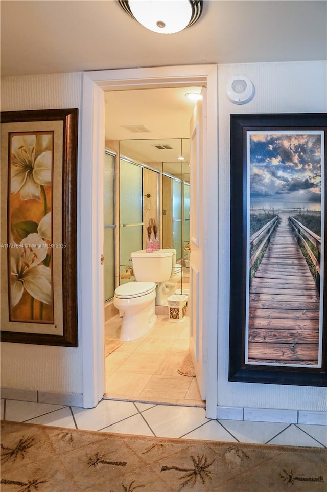 hall featuring tile patterned floors